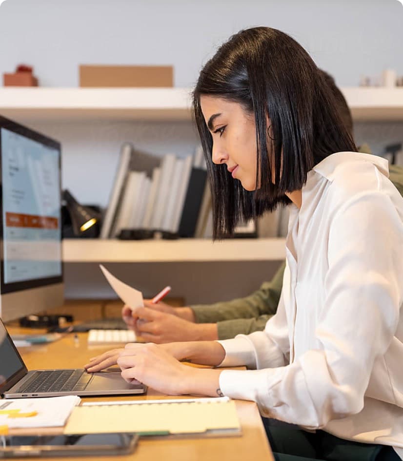 Happy woman working on laptop